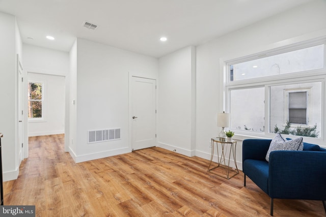 unfurnished room with light hardwood / wood-style floors