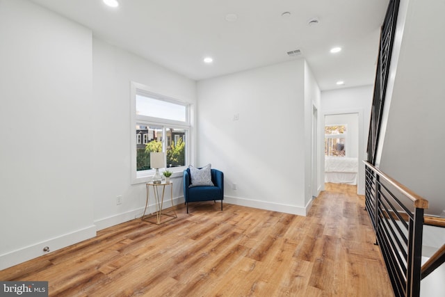 living area with light hardwood / wood-style flooring