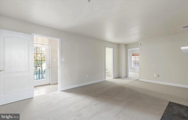 empty room with light colored carpet