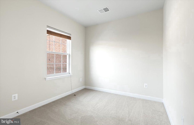 empty room featuring carpet floors