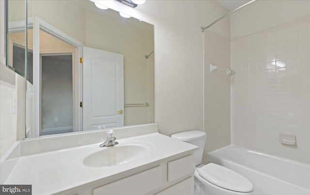 full bathroom with vanity, toilet, and tiled shower / bath