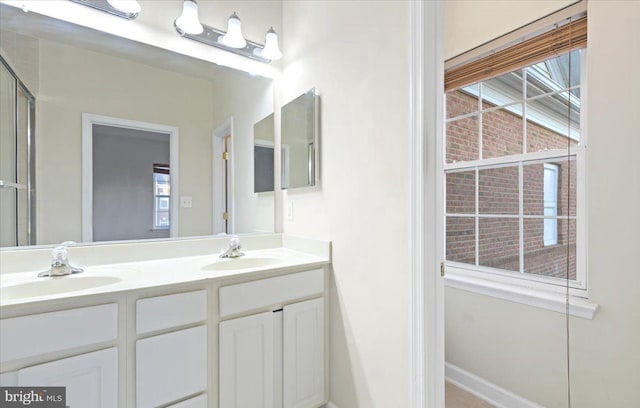 bathroom featuring vanity and a wealth of natural light