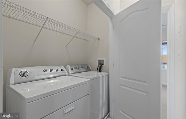 laundry area with washing machine and dryer