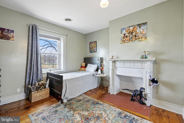 bedroom featuring hardwood / wood-style floors