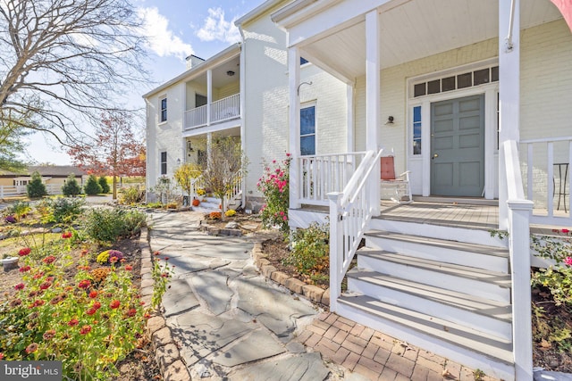 doorway to property with covered porch