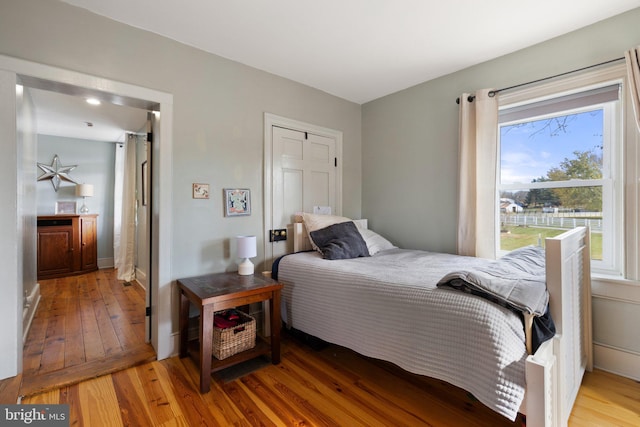 bedroom with light wood-type flooring