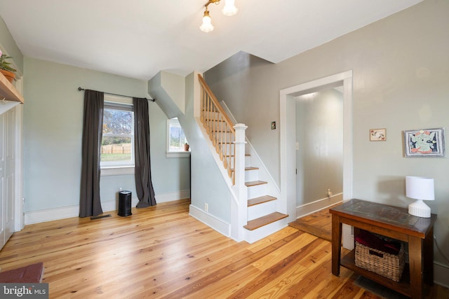 staircase featuring wood-type flooring