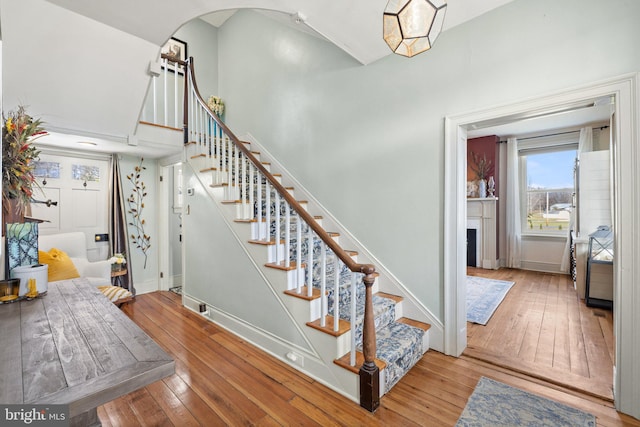 staircase featuring wood-type flooring