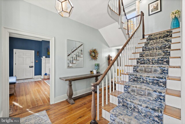 stairway with wood-type flooring