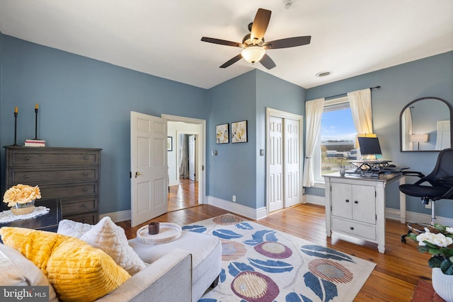 interior space featuring ceiling fan, a closet, and light hardwood / wood-style flooring