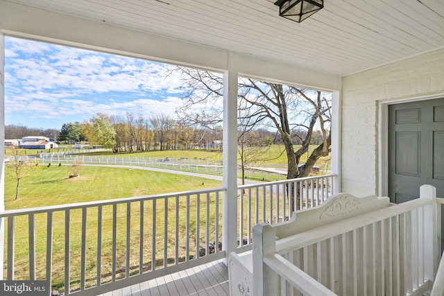 unfurnished sunroom with wood ceiling