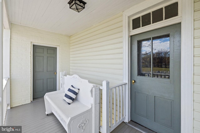 doorway to property featuring a porch