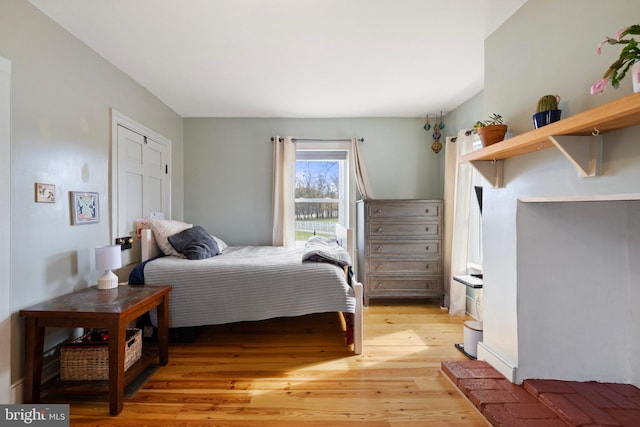 bedroom with light hardwood / wood-style floors