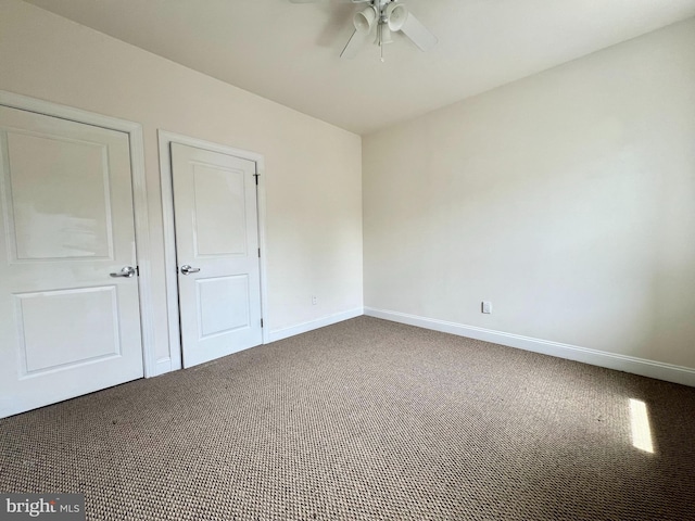 unfurnished bedroom with carpet flooring and ceiling fan