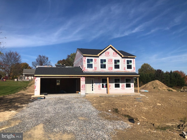 view of front facade featuring a garage and a porch