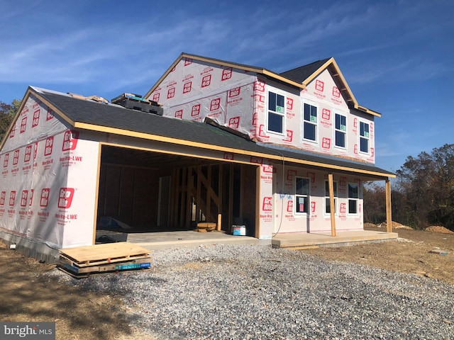 property in mid-construction with covered porch