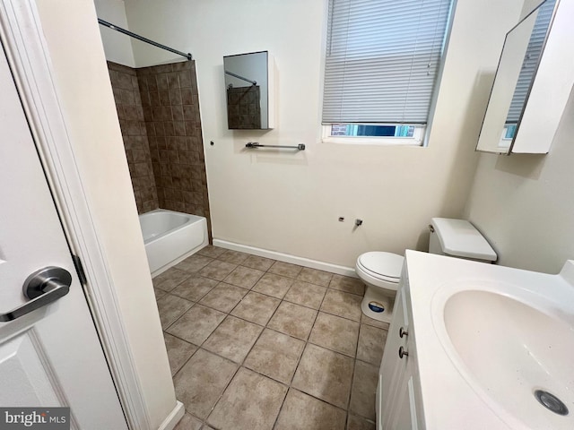 full bathroom featuring tiled shower / bath, tile patterned floors, vanity, and toilet