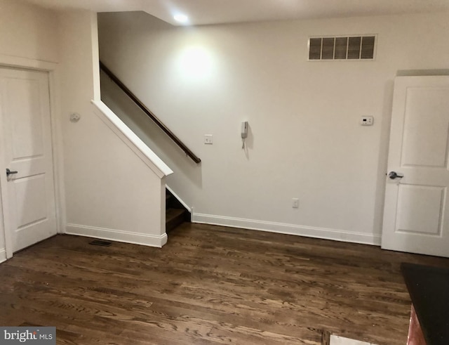 interior space with dark wood-type flooring