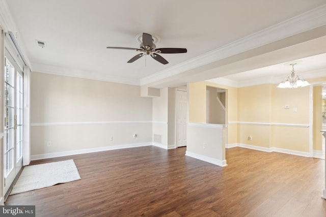 unfurnished room featuring ceiling fan with notable chandelier, dark hardwood / wood-style flooring, ornamental molding, and french doors