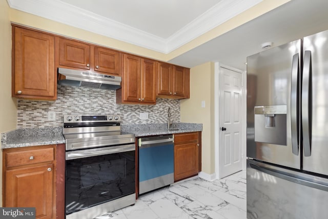 kitchen featuring light stone countertops, appliances with stainless steel finishes, tasteful backsplash, and crown molding