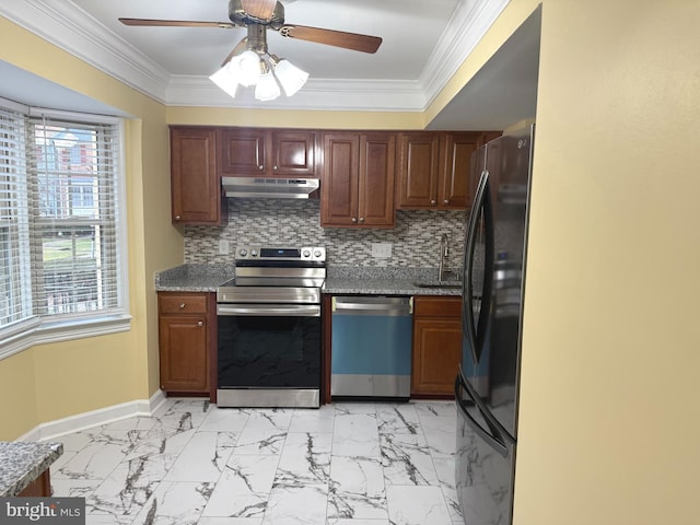 kitchen featuring backsplash, sink, ceiling fan, ornamental molding, and appliances with stainless steel finishes