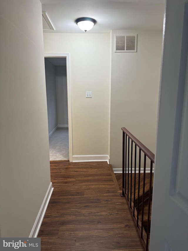 corridor featuring dark hardwood / wood-style floors