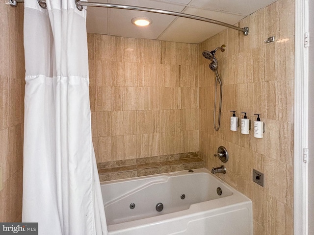 bathroom with shower / bath combo with shower curtain