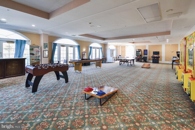 playroom featuring ornamental molding, carpet, a raised ceiling, and french doors