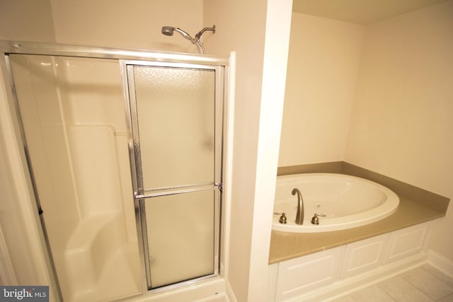 bathroom with plus walk in shower and tile patterned floors