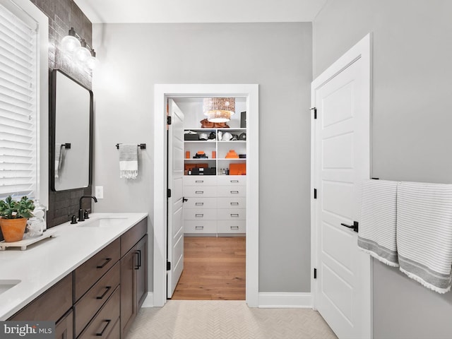 bathroom with vanity and hardwood / wood-style flooring