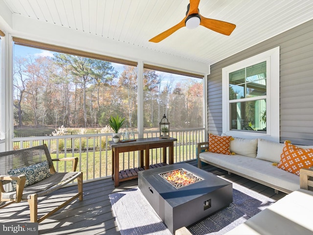 sunroom with wooden ceiling and ceiling fan