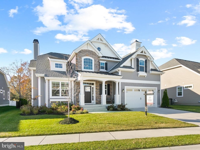 craftsman-style house with a garage and a front lawn