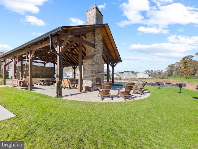 surrounding community with a lawn, a gazebo, and a patio area