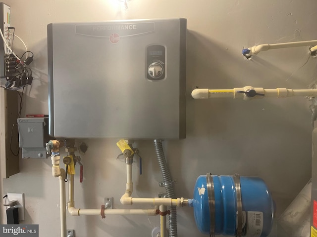 utility room with water heater