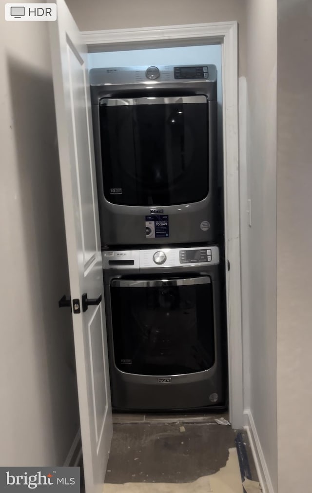 laundry area featuring stacked washer and clothes dryer