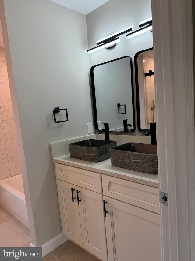 bathroom with vanity and tile patterned flooring