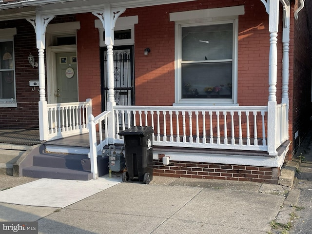 doorway to property featuring a porch