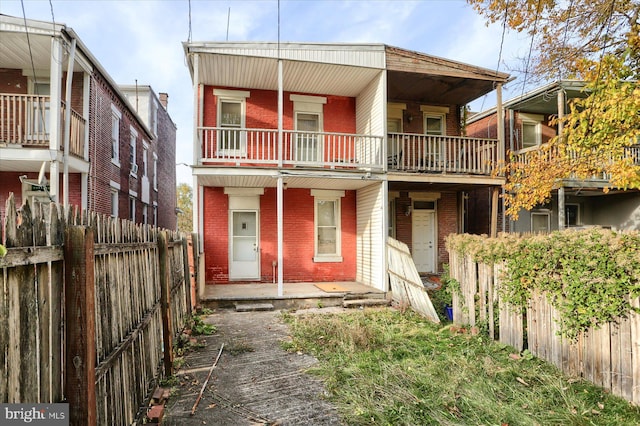 view of front of house featuring a balcony