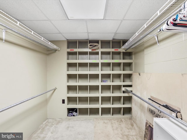 walk in closet with a drop ceiling