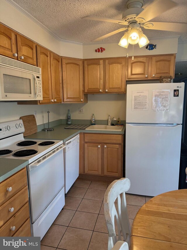 kitchen with a textured ceiling, white appliances, ceiling fan, sink, and light tile patterned flooring