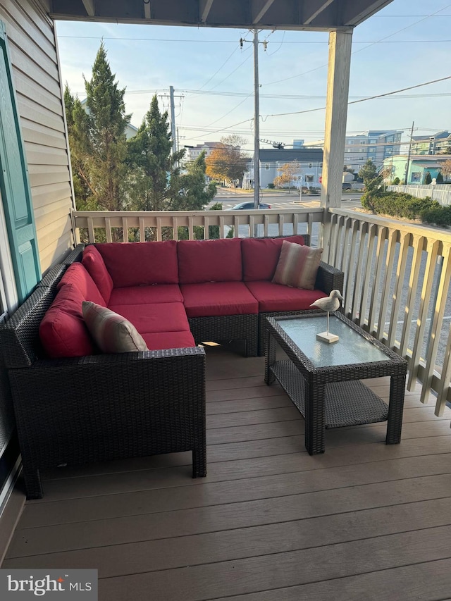 wooden terrace with outdoor lounge area