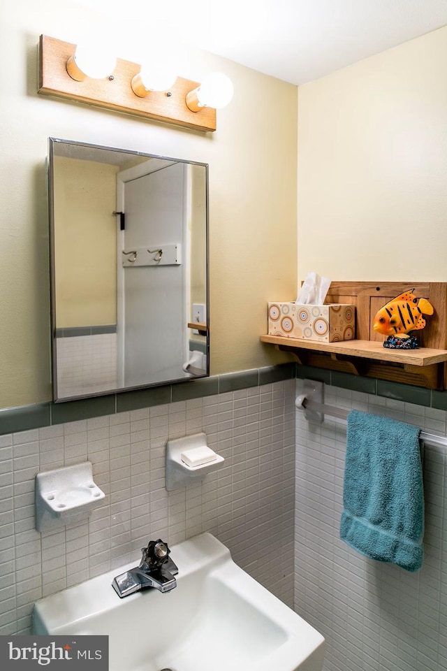 13 75th St Unit 1W, Ocean City, MD 21842 - bathroom with a sink, tile walls, and a wainscoted wall
