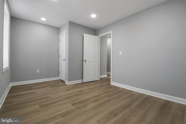 unfurnished bedroom featuring hardwood / wood-style floors