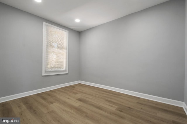 spare room featuring hardwood / wood-style floors