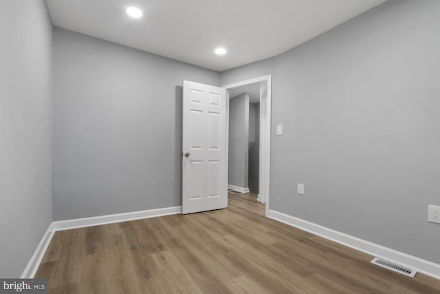 spare room with light hardwood / wood-style floors