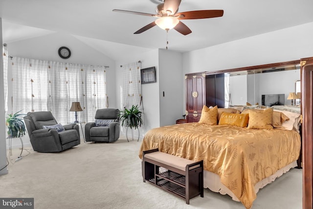 bedroom with carpet flooring, ceiling fan, and vaulted ceiling