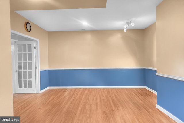 spare room featuring light wood-type flooring