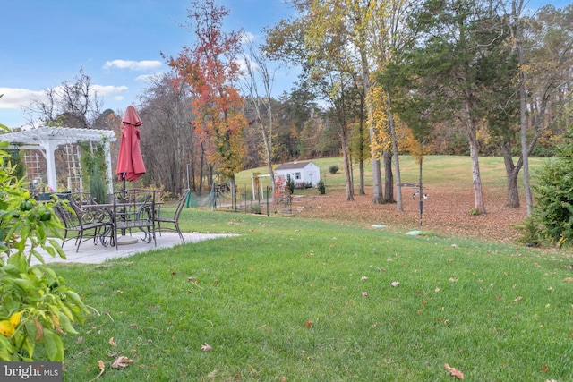 view of yard featuring a pergola and a patio