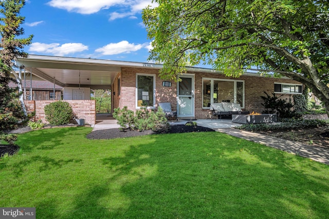 ranch-style house featuring a carport and a front yard