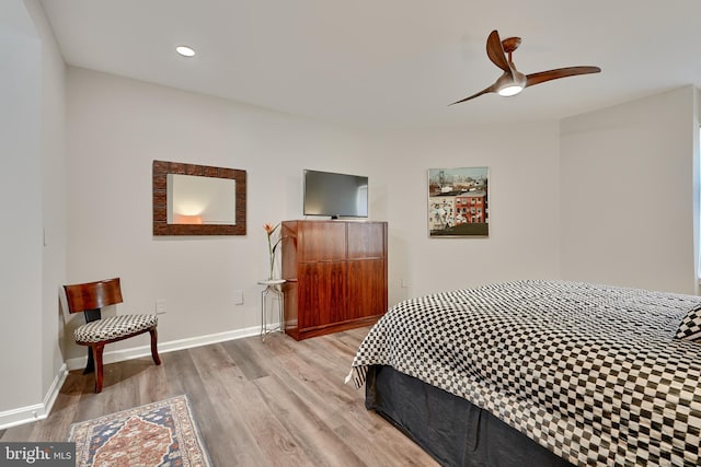 bedroom with ceiling fan and light wood-type flooring